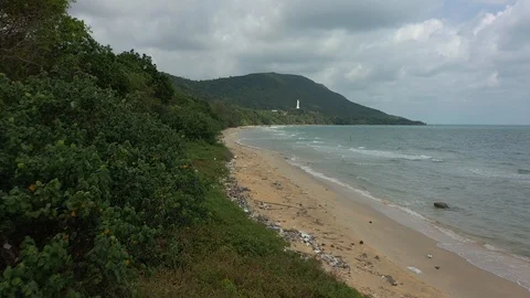 Flying above garbage on a beach shore trash everywhere next to ocean sea water Stock Footage 124602852