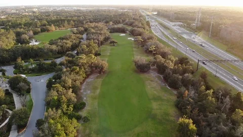 Flying above a Golf course at sunset. Stock Footage 125711388