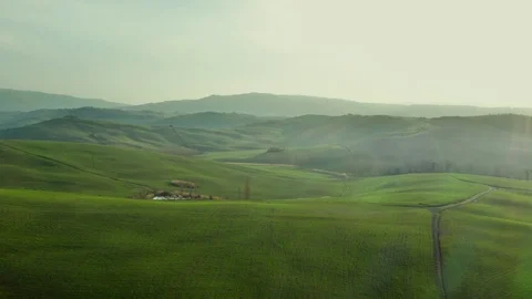 Flying above green spring landscape and  a lake Stock Footage 127363376