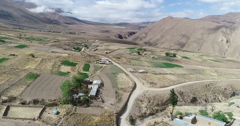 Flying above grid of crops of local farming at high mountain slopes. Salta 스톡 동영상 103514648