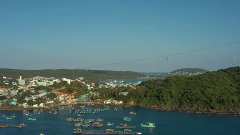 Flying above harbour next to old town at the shore in the sounth in sunset with Video stock 124366345