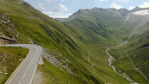 Flying above high mountain alpine road on Furka pass Video stock 142160775