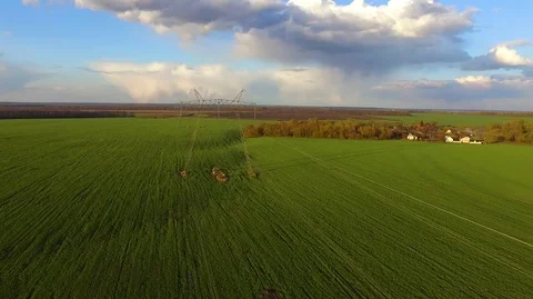 Flying above high voltage electricity tower and power lines Stock Footage 75687480
