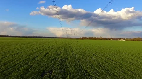 Flying above high voltage electricity tower and power lines Stock Footage 75687621