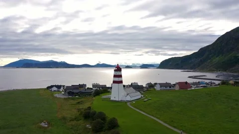 Flying above the iconic Alnes Lighthouse on a cloudy day, Aerial Orbit Stock Footage 219418914
