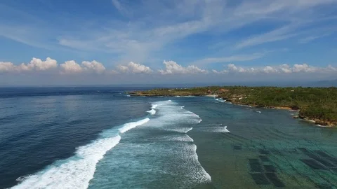Flying above long ocean waves along coast line Stock Footage 111780265
