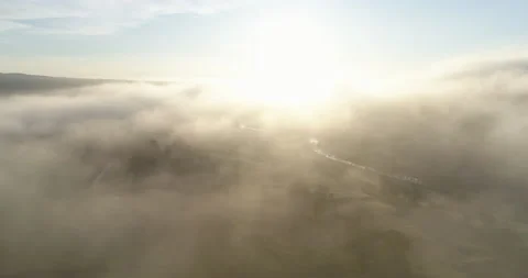 Flying above low clouds at sunrise Video stock 156166193