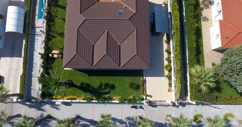 Flying above luxury complex beach front villas with perfect exotic location Stock Footage 91985387