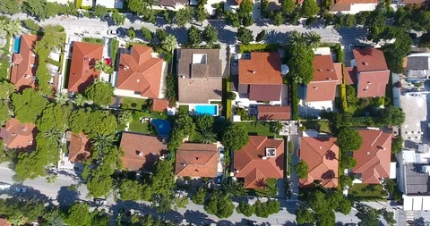 Flying above luxury complex beach front villas with perfect exotic location Stock Footage 91985488