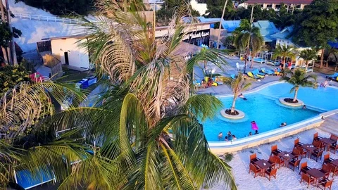 Flying above luxury secluded beachfront resort Stock Footage 86550180