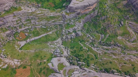 Flying Above Massive Rock Formations in a Dramatic Mountain Landscape Stock Footage 341146075