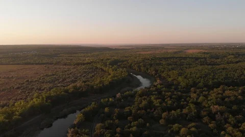 Flying above Milk river with forests and fields in Ukraine, Melitopol, Sosnovka  Stock Footage 114218591
