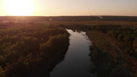 Flying above Milk river with forests and fields in Ukraine, Melitopol, Sosnovka  Stock Footage 114219287
