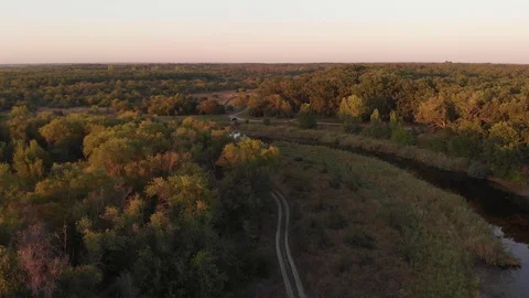 Flying above Milk river with forests and fields in Ukraine, Melitopol, Sosnovka  Stock Footage 114247018