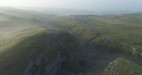 Flying above misty limestone valley Video stock 166389908