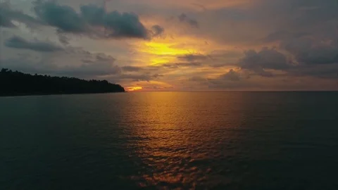 Flying above the ocean during sunset, Thailnd Stock Footage 89949809