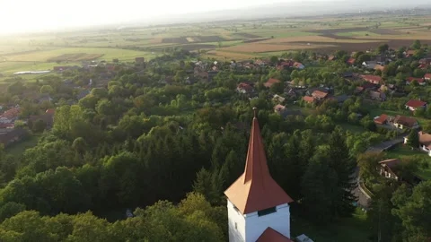 Flying above old whitewashed reformed church and cemetery aerial Stock Footage 252174255