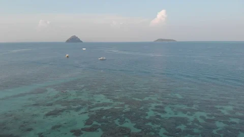 Flying above open sea clear waters of Laem Tong, Part Of Phi Phi Island. Stock Footage 93090801