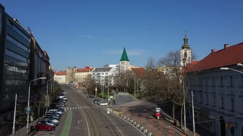 Flying above railways on empty SPN square in centre Bratislava, with tram Stock Footage 127449503
