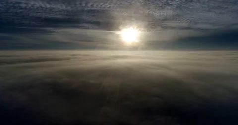 Flying above real clouds into sun Stock Footage 91468266
