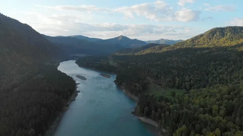 Flying above riverbed and mountain valley in summer day. Stock Footage 124363142