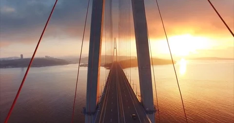 Flying above the road and between cables Russian bridge. Amazing sunrise. Russia Stock Footage 82800296