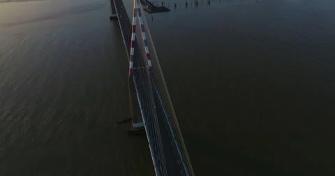 Flying above the road of cable-stayed French bridge. Amazing sunrise. Aerial Stock Footage 240141284