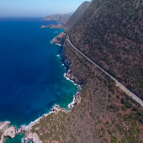 Flying above road by seashore Stock Footage 69722466