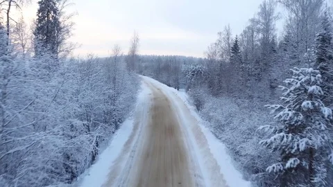 Flying above the road in winter forest Stock Footage 72233819
