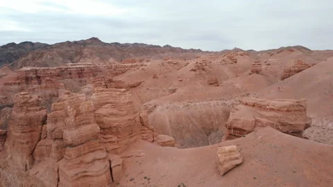 Flying above Rock formation, stone pillars in red canyon. Sharyn Canyon Stock Footage 219946108