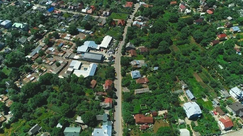 Flying above the rooftops of beautiful idyllic wooden row houses in subdivision Stock Footage 115832094