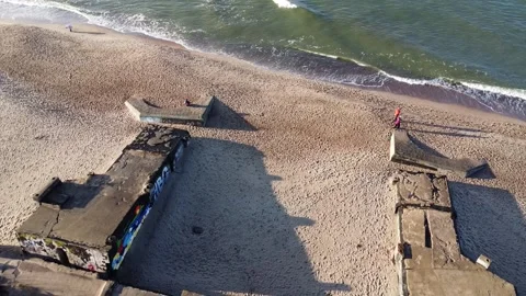 Flying Above Rough Baltic Sea Toward Concrete Bunker Stock Footage 330231959