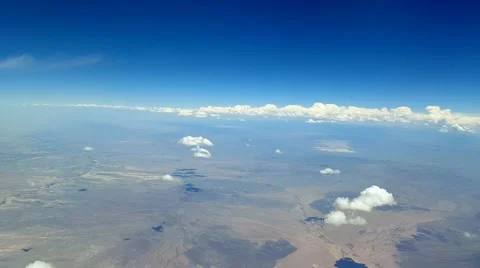Flying above small cumulus clouds over the desert Vídeos de archivo 63644776