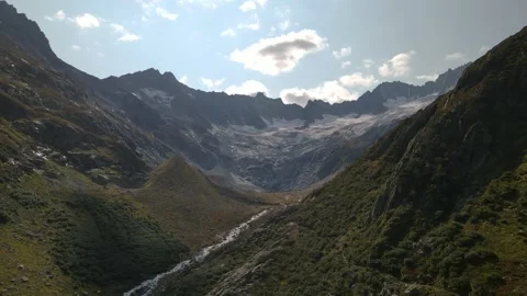 Flying above the small valley towards the Damm glacier close to Goschenen Video stock 140616110