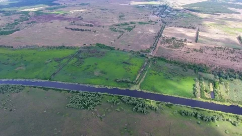 Flying above the small wild river canal Stock Footage 83260028