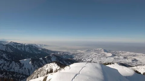 Flying above the snow mountain Video stock 90027672