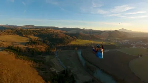 Flying above spring nature, Paragliding adrenaline adventure freedom Follow 動画素材 267570141