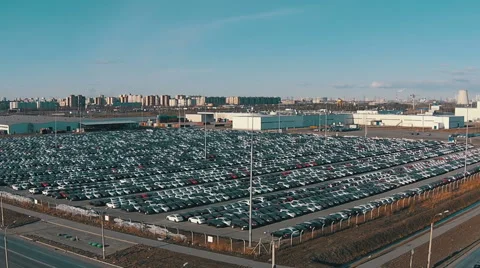 Flying Above Storage Parking Lot of New Unsold Cars Stock Footage 48295666