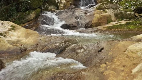 Flying above stream water with rocks Stock Footage 333713946