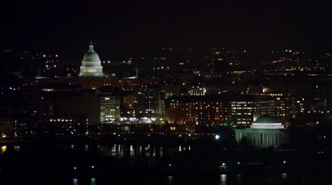 Flying above the Tidal Basin at night, Capitol in background, Jefferson Memorial Vídeo Stock 59196107