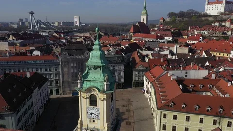 Flying above a totally empty Main Square in centre of Bratislava, tower clock Stock Footage 127449646