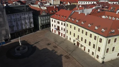 Flying above a totally empty Main Square in centre of Bratislava pigeon attack Stock Footage 127450199