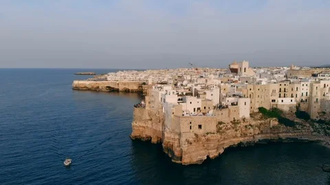 Flying up above town of Polignano a Mare by sea 스톡 동영상 112576189