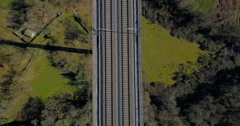 FLYING ABOVE THE TRAIN BRIDGE IN A GREEN VALLEY Stock Footage 103265954