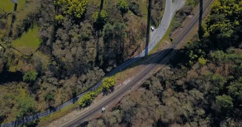 FLYING ABOVE THE TRAIN BRIDGE IN A GREEN VALLEY Stock Footage 103265968