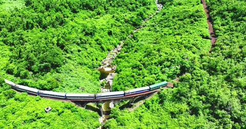Flying above train rushing along the picturesque Hai Van Pass, Hue, Vietnam Stock-Footage 342394737