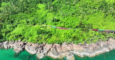 Flying above train rushing along the picturesque Hai Van Pass, Hue, Vietnam 库存影片 342394908