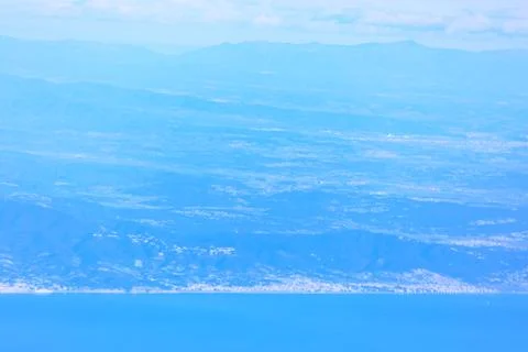 Flying above a tranquil sea Stock Photos