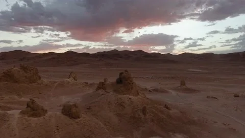 Flying above tufa formations of Trona Pinnacles at sunset Stock Footage 195116765