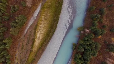Flying above turquoise colored glacial river in the Alaskan range Stock Footage 138611426